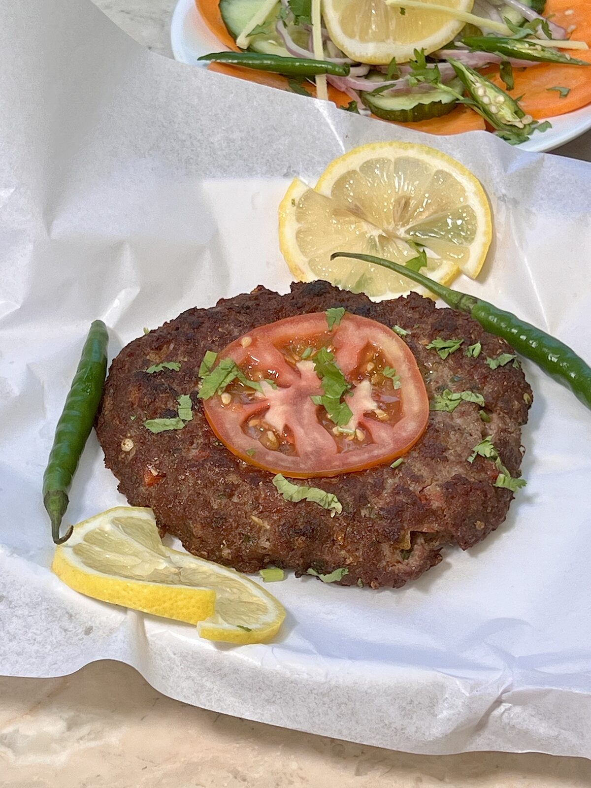 Chapli Kabab with tomato and green chilli